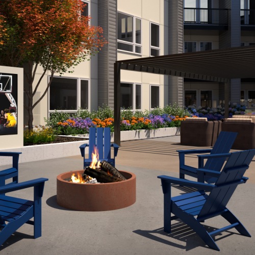 Outdoor seating area with large entertainment TV at Reverie Apartments