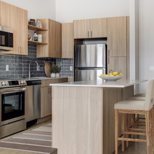 a kitchen with a stove and oven