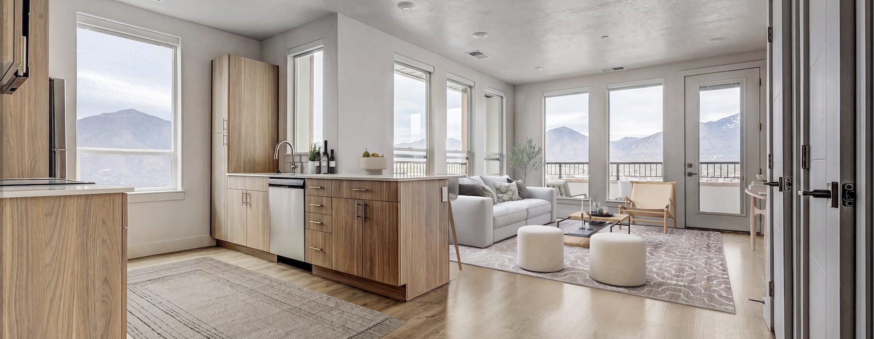 a living room with a couch and wood floors