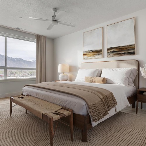 a bedroom with a bed and a table