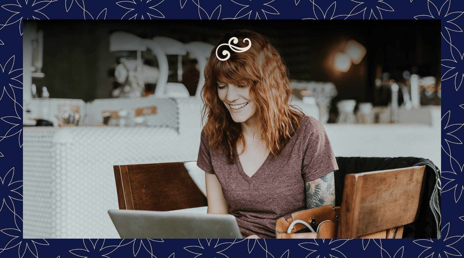a woman smiling at a computer